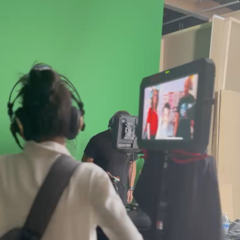 Director Ana Clavell watches the scene via monitor